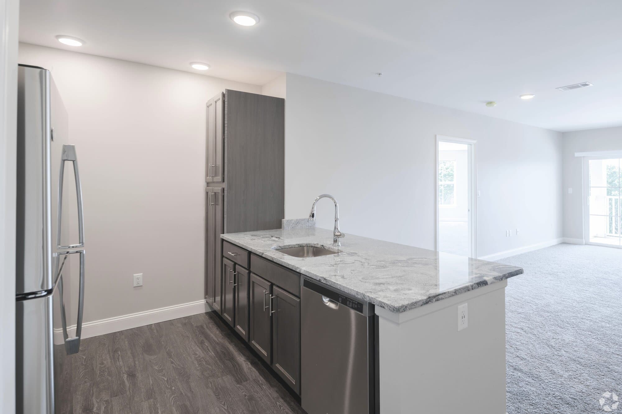 2-bedroom kitchen with stainless appliances and granite counters.